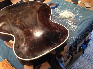 After re-assembly, binding wqas replaces to reinforce back plate. Instrument was left in original paint finish for authenticity