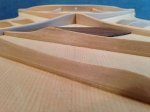 Low angle of carved x- braces on a Jay Rosenblatt Guitar