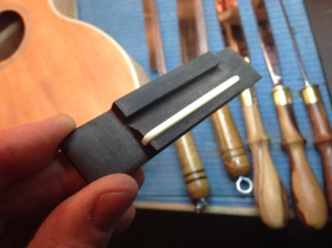 Handmade Ukulele bridge of ebony and bone © Jay Rosenblatt