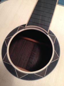 Maple bound Ebony fingerboard with Ebony and Maple Geometric Rosette on a Jay Rosenblatt guitar